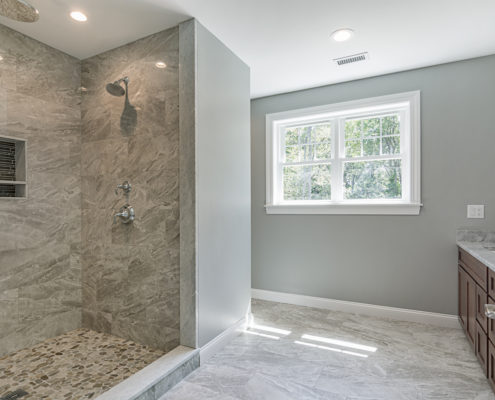 Custom bathroom with spacious built-in shower and countertop sinks
